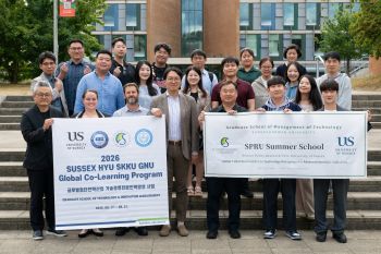 HYU GNU and SKKU university students and faculty from Korea pose with SPRU faculty outside of University of Sussex Business School