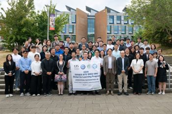 HYU GNU and SKKU university students and faculty from Korea pose with SPRU faculty outside of University of Sussex Business School