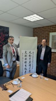 Professor Michael Luck, Deputy Vice-Chancellor and Provost at Sussex, on behalf of the Vice-Chancellor and President, Professor Sasha Roseneil, received a calligraphy couplet from Professor Hu Zhifeng, Dean of the School of Arts and communication