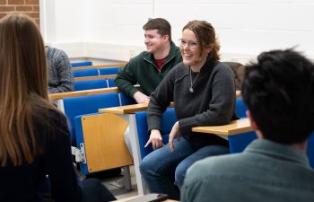 Students laughing and talking at a Placements event