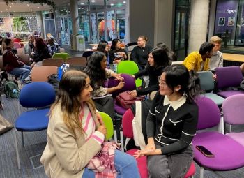 A photo of students sat in chairs talking enthusiastically with each other at a previous entrepreneurship event