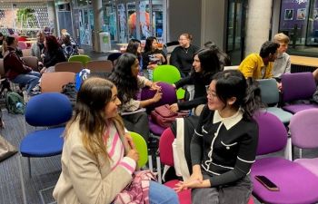 A photo of students sat in chairs talking enthusiastically with each other at a previous entrepreneurship event