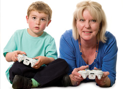 woman and boy playing computer game
