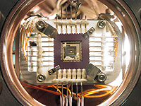 Ion trap microchip for quantum computing with single atoms