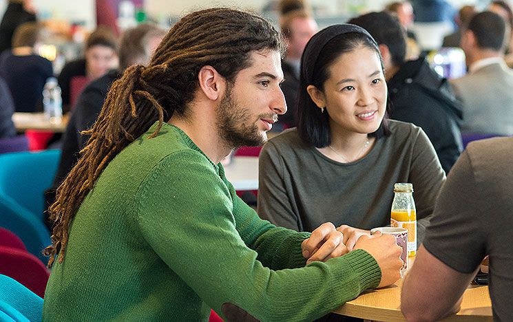 Students in conversation in the social space