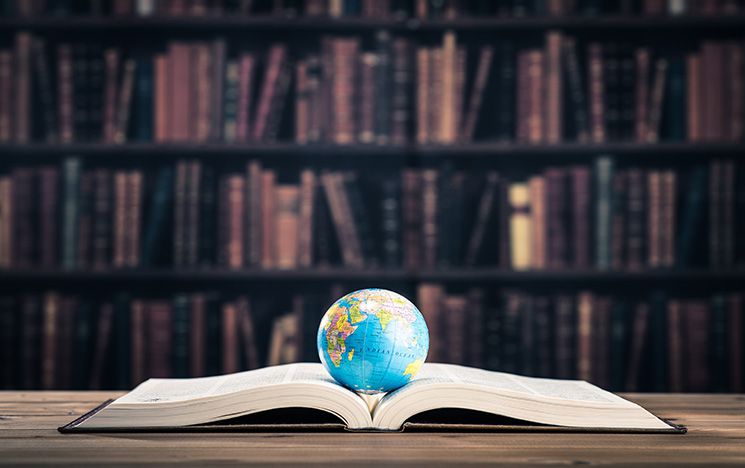 book with world on top