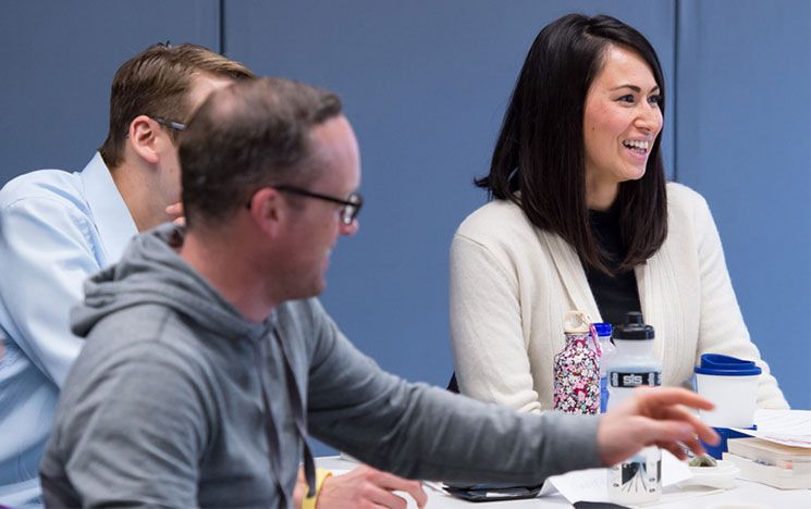 students smiling in a seminar