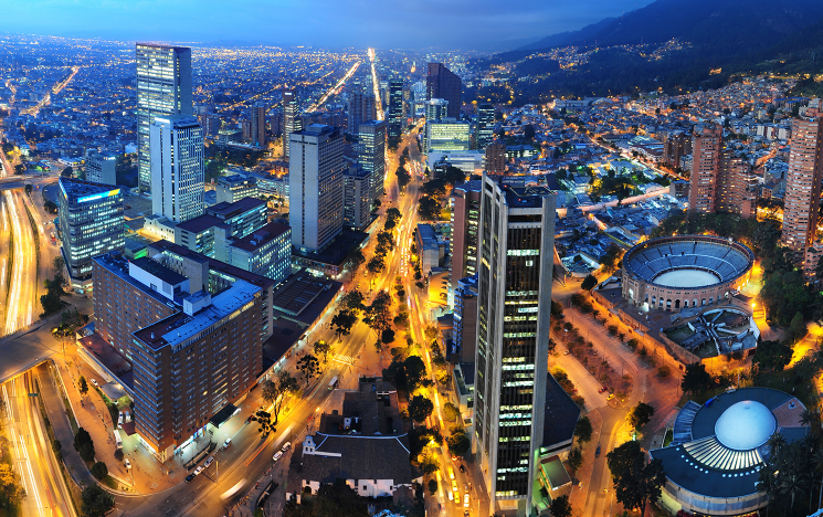 A view of a Colombian city at night from above