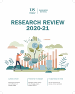 Front cover of Research Review publication depicting vaccines parachuting down