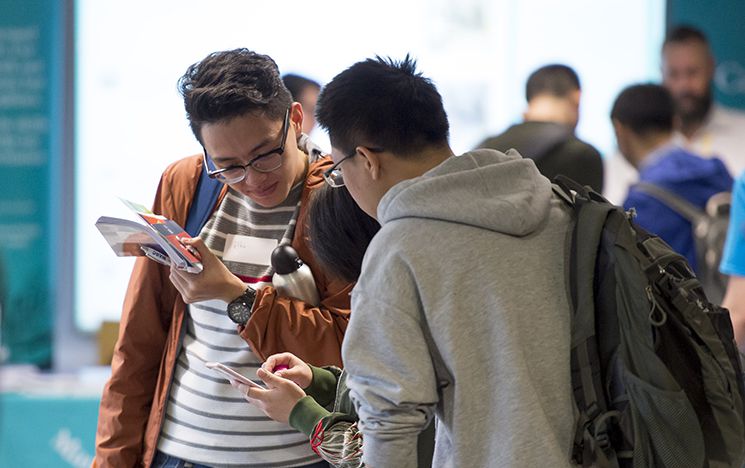 Students looking at information