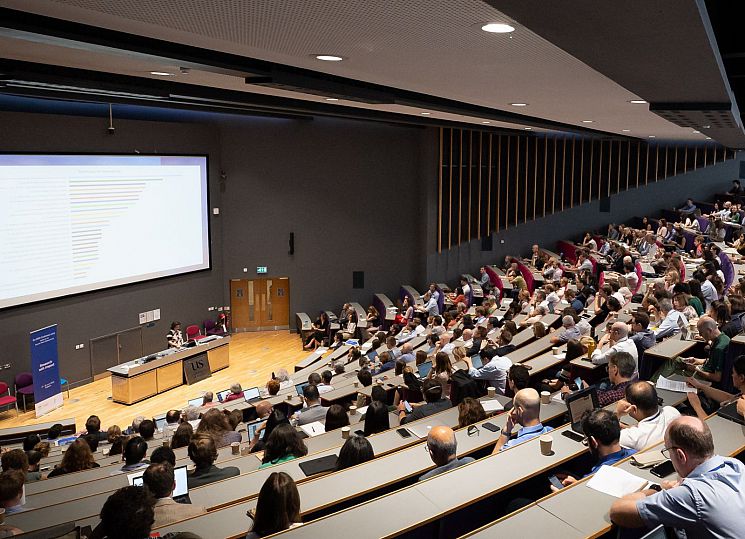 Crowd of attendees in Business School lecture theatre for Eu-SPRI 2023 Conference