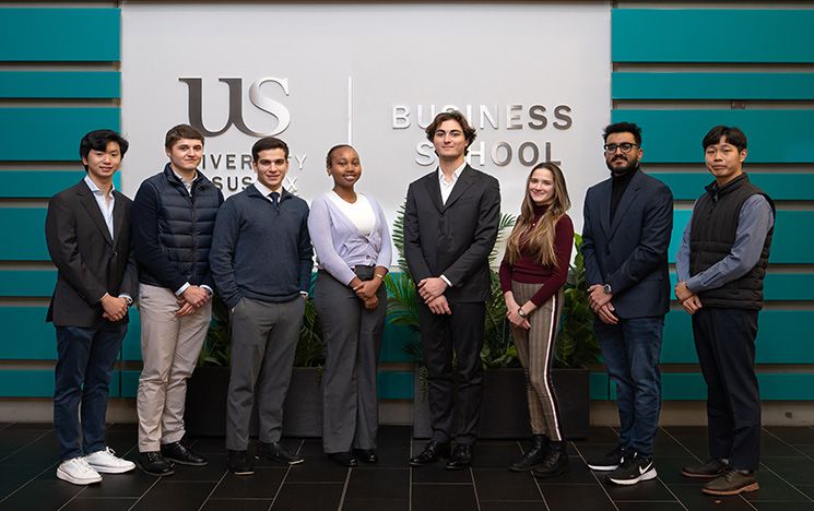 Nemea Fund  group photo in Jubilee in front of the Business School sign