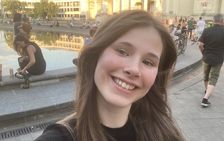 Bryony Hawkins on her study abroad trip in Vienna, Austria, standing outside smiling at the camera