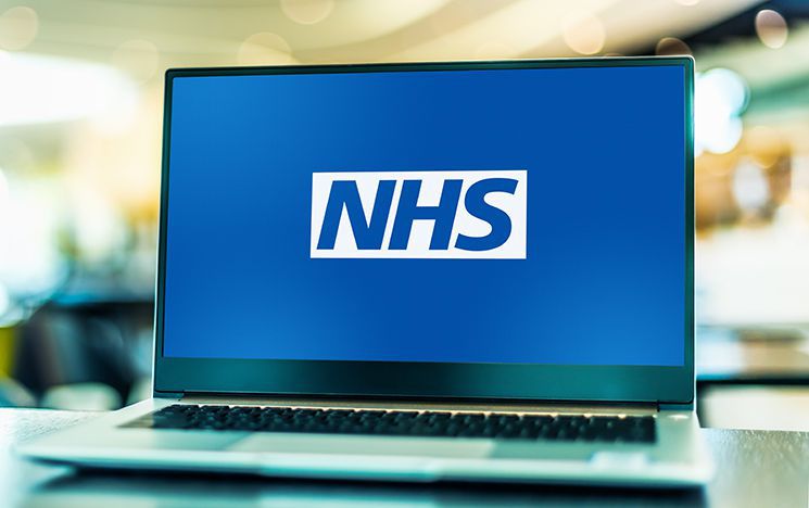 Laptop featuring NHS logo on the screen
