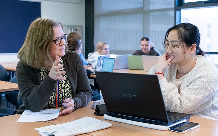 Clare Edwards teaching a student in class