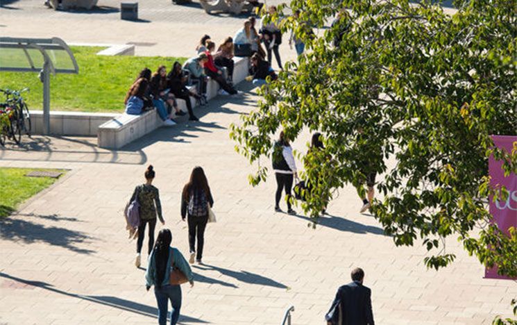 Students and staff walking towards the Jubilee building