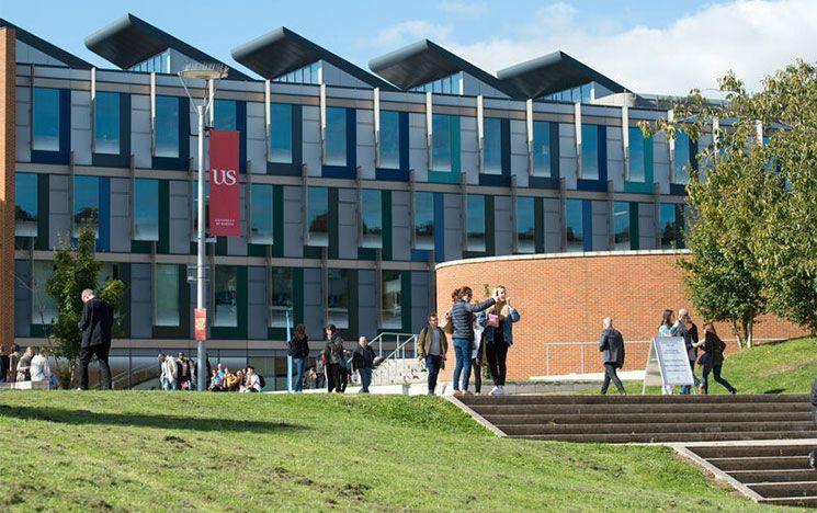 Visitors looking around the University campus outside Jubilee building