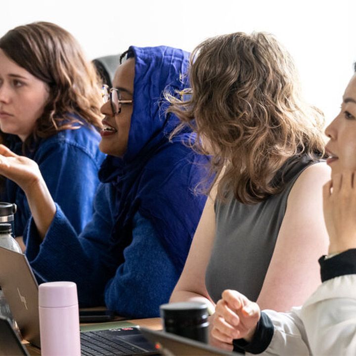 Students listening and talking at a seminar