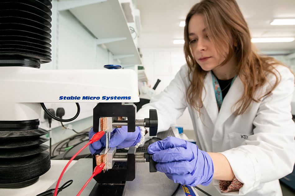 female working in a physics lab