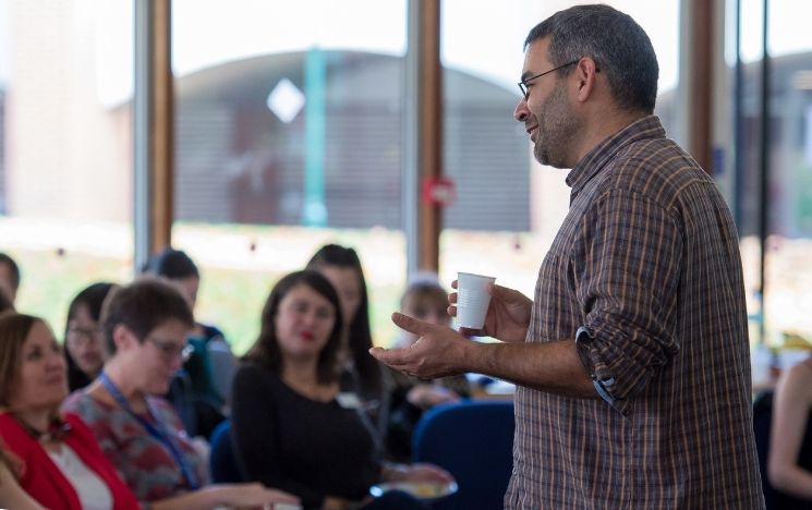 Robin Banerjee introducing the Kindness Symposium 2018