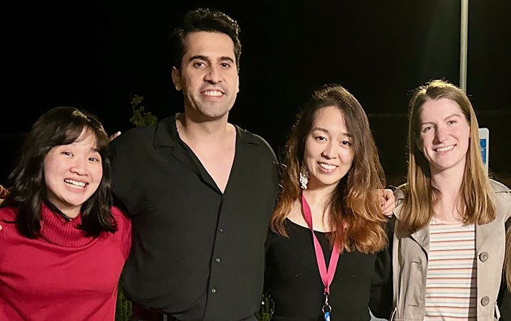 four MA migration students posing together