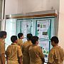 Students are watching poster of French Institute, Pondicherry