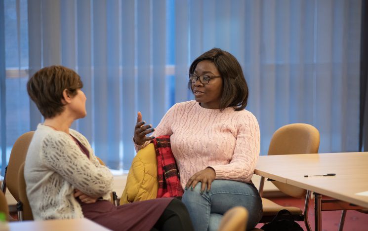 A patient in discussion with a social worker