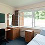 Norwich House accommodation bedroom desk and sink area