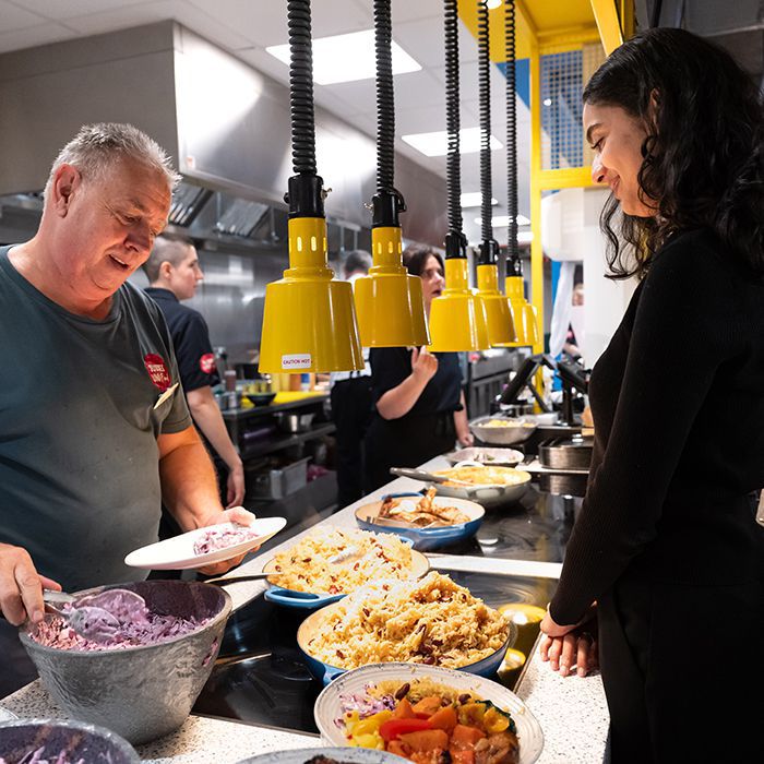 A student being served their food in Eat Central