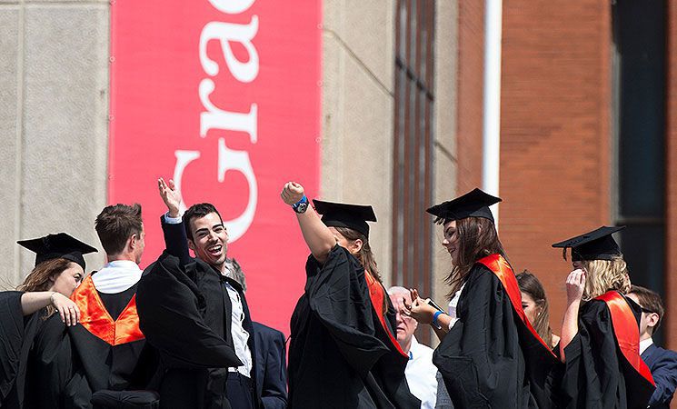 Students in the gowns outside the Brighton Centre