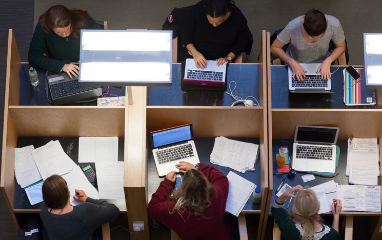 Students sat on desks working