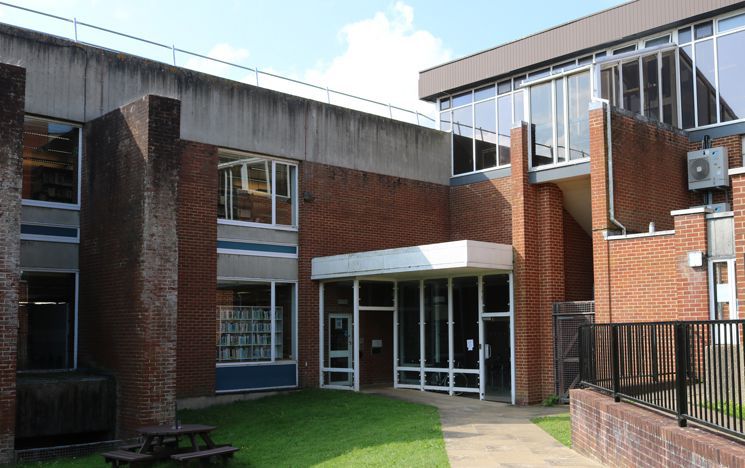 The Library’s accessible north door off of Library Road next to the Institute for Development Studies Café