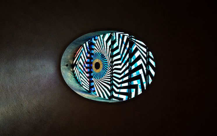 The 'eye' rooflight in the Meeting House, designed by Sir Basil Spence's son-in-law and business partner, Anthony Blee, and made in coloured glass and black epoxy resin.