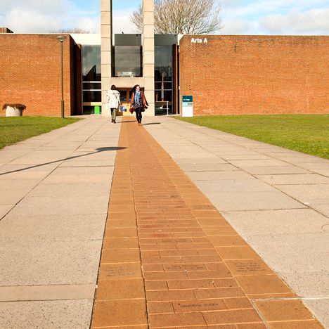 The path from Library Square to the Arts A building on campus, with engraved paving slabs transforming this familiar route into a memorial for students and staff.