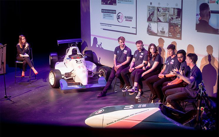 Members of Sussex Racing n stage at ACCA with their cars, one in the 2022 livery.