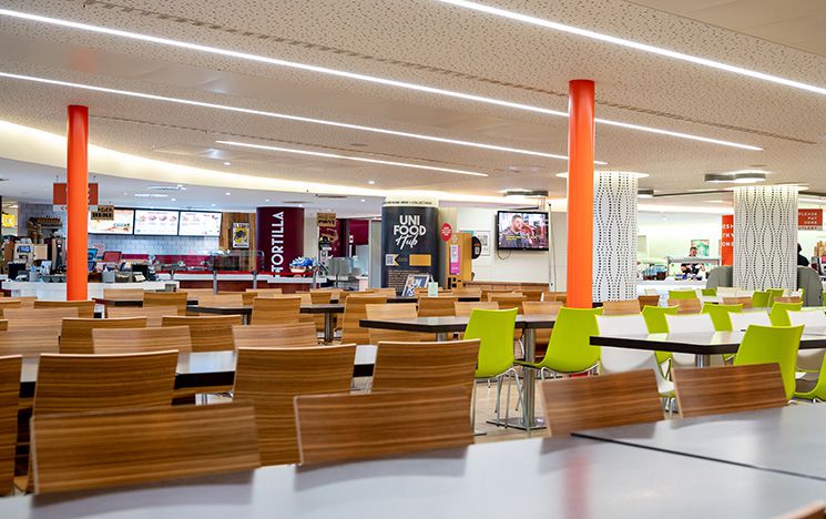 The seating area of Eat Central with chairs and tables nicely arranged