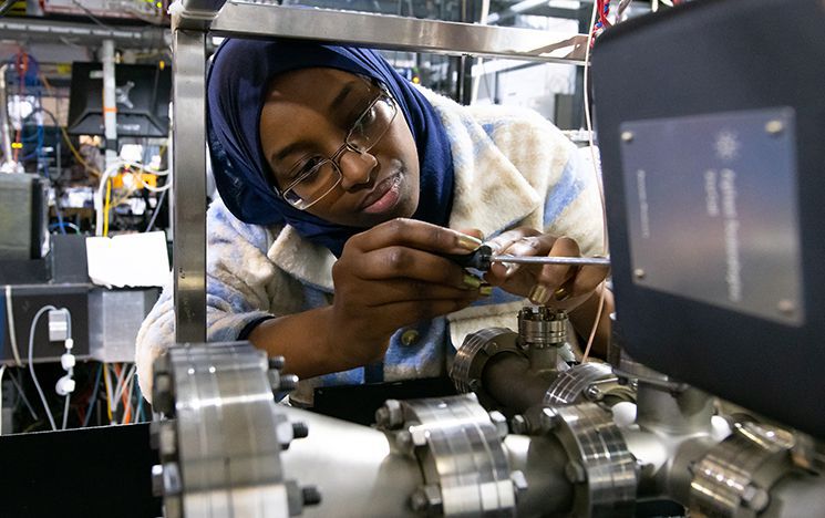 A woman using a screwdriver