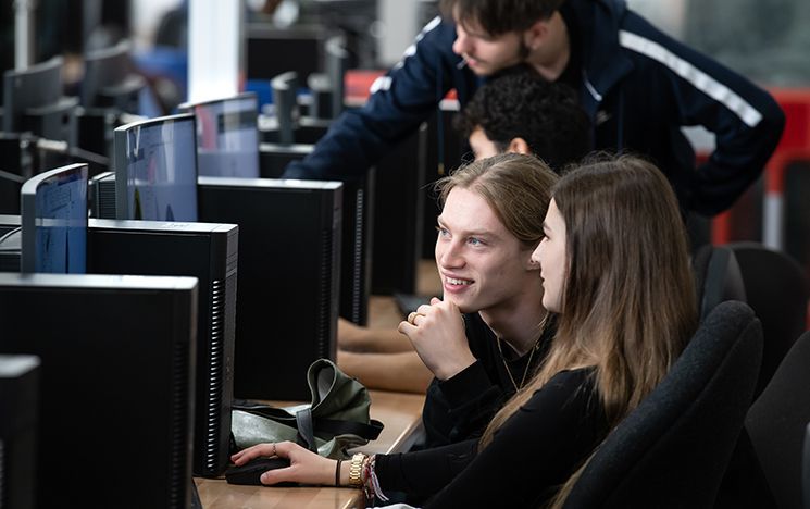 Students looking at computers