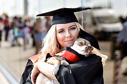Summer Graduation 2018 A student celebrates graduation with her four-legged friend.
