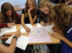 Pupils working on a maths problem at the maths enrichment day on campus in autumn 2012.