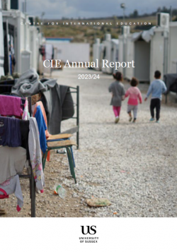 Front cover of CIE Annual Report - image of three children walking away from the camera, arm in arm, in a refugee camp.