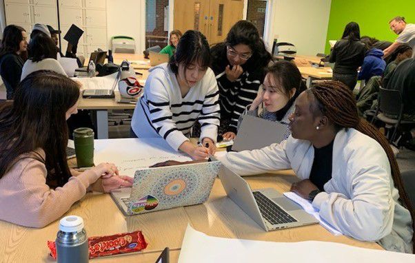 CIE students working around a table