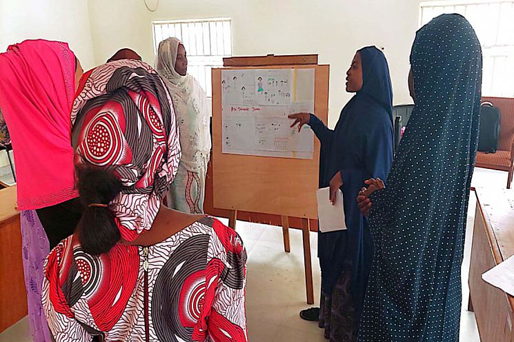 Girei CRPs discussing their community mapping.