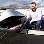 Simon with HiSPARC module on the roof of the University of Sussex Physics & Astronomy department