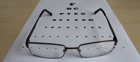 an eye test chart and a pair of glasses