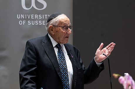 Manfred Goldberg speaking in the lecture theatre at Holocaust Memorial Day at Sussex 2023