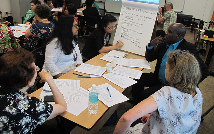 The migrating out of poverty team working on a project