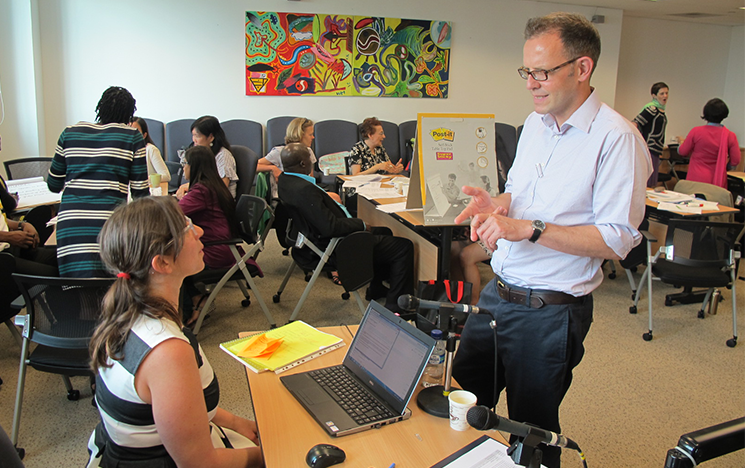 Researchers discussing a project in a seminar room