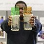 A student displays two working water filter prototypes