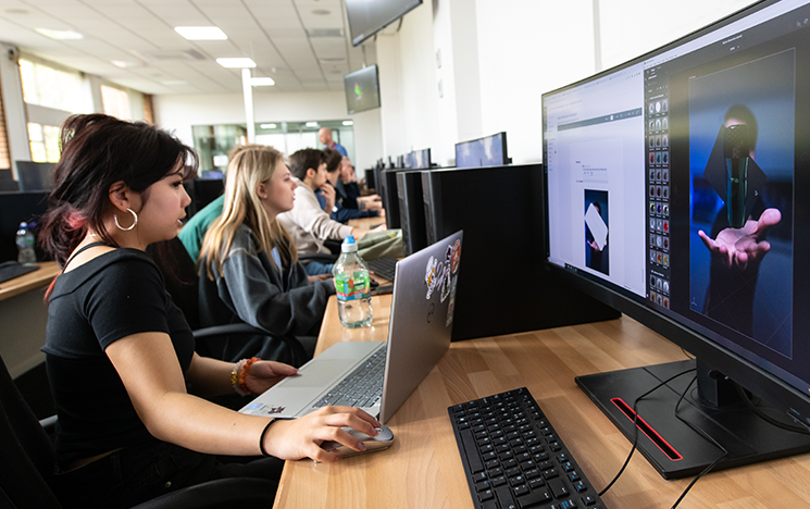 Two student using computers in the computer-aided design lab